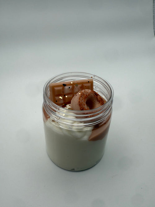 Small container with a brown cylindrical object inside on a white background