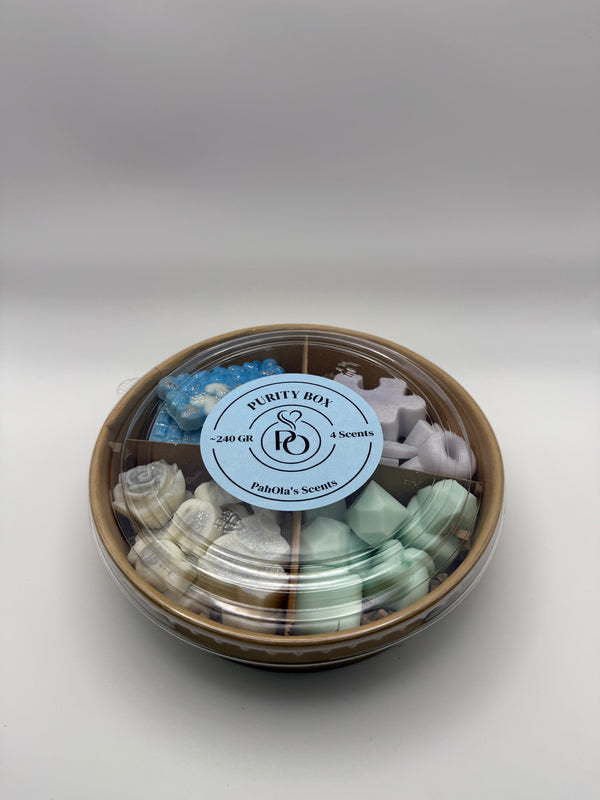 Round container of colorful wax melts on a white background